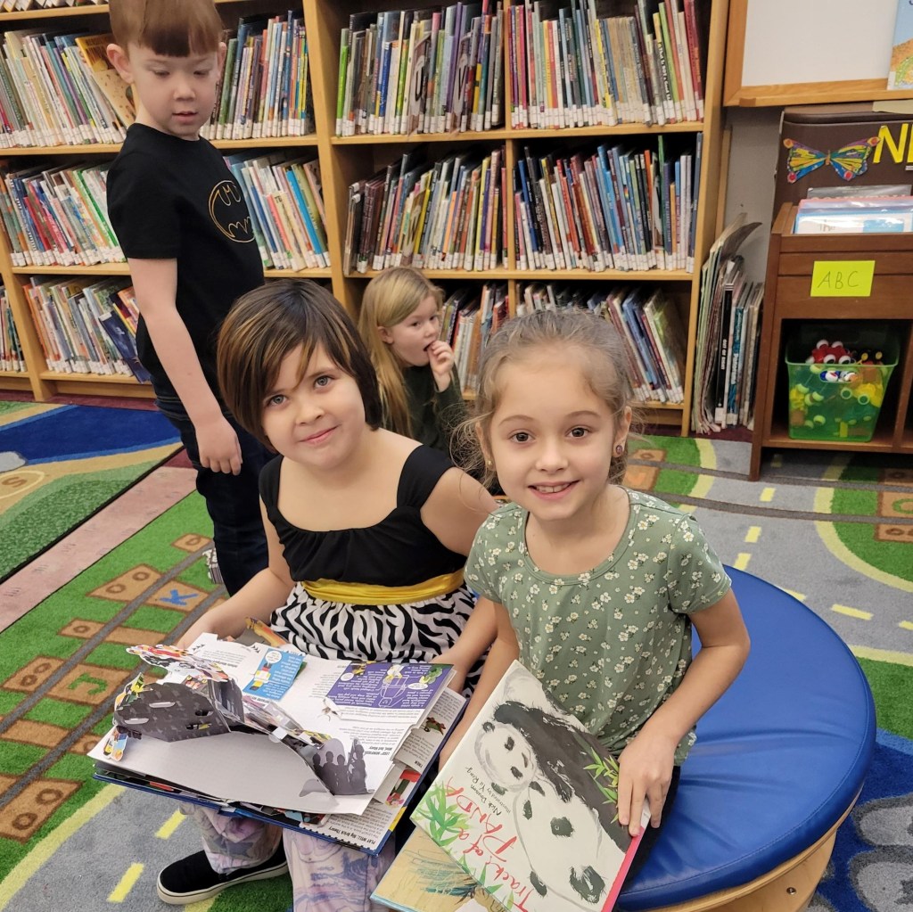 Elementary students visiting library
