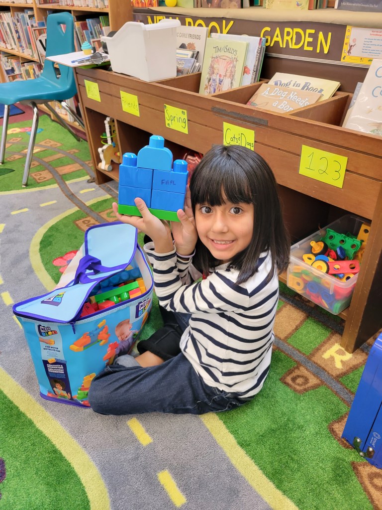 Elementary students visiting library